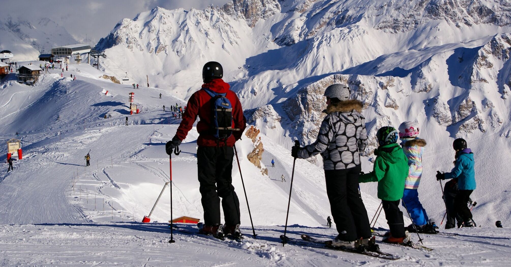 Skiers overlooking the slopes in Courchevel