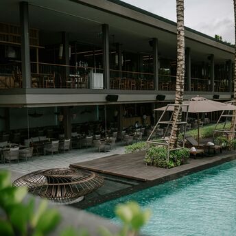 Resort complex with poolside dining area
