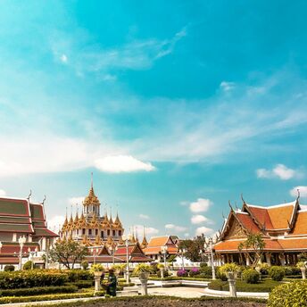Bangkok temple complex under clear blue sky