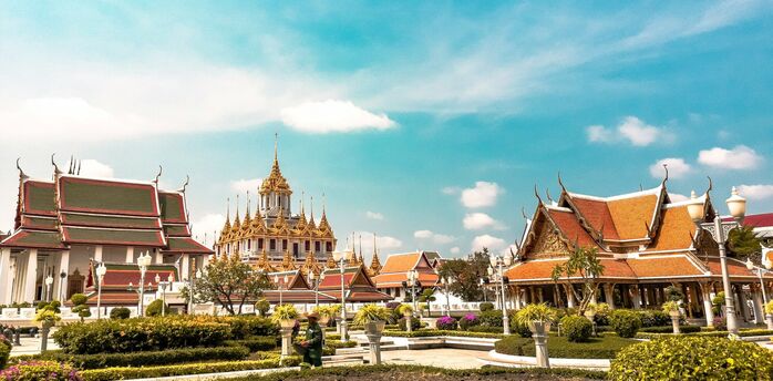 Bangkok temple complex under clear blue sky