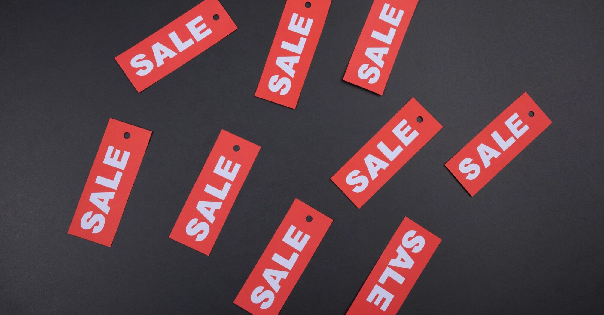 Sale tags symbolising limited-time travel discounts