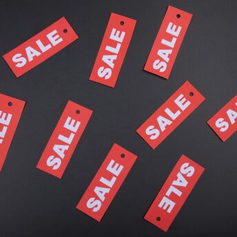 Sale tags symbolising limited-time travel discounts