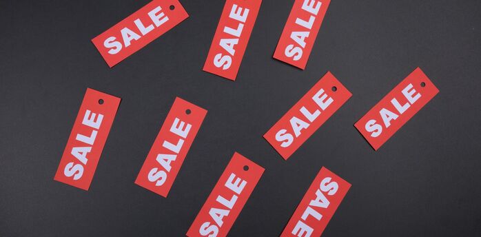Sale tags symbolising limited-time travel discounts