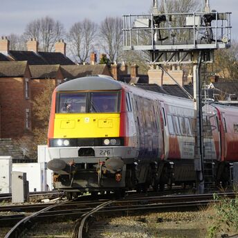 Passenger train passing through rail junction in Wales