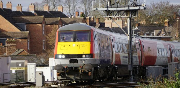 Passenger train passing through rail junction in Wales