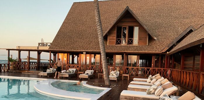 Tropical resort-style pool with wooden terrace