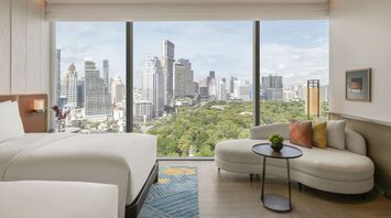 Guest room overlooking Lumphini Park in central Bangkok