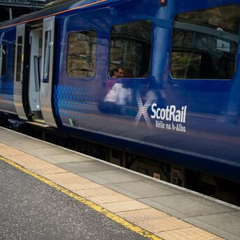 ScotRail train at a station platform in Scotland