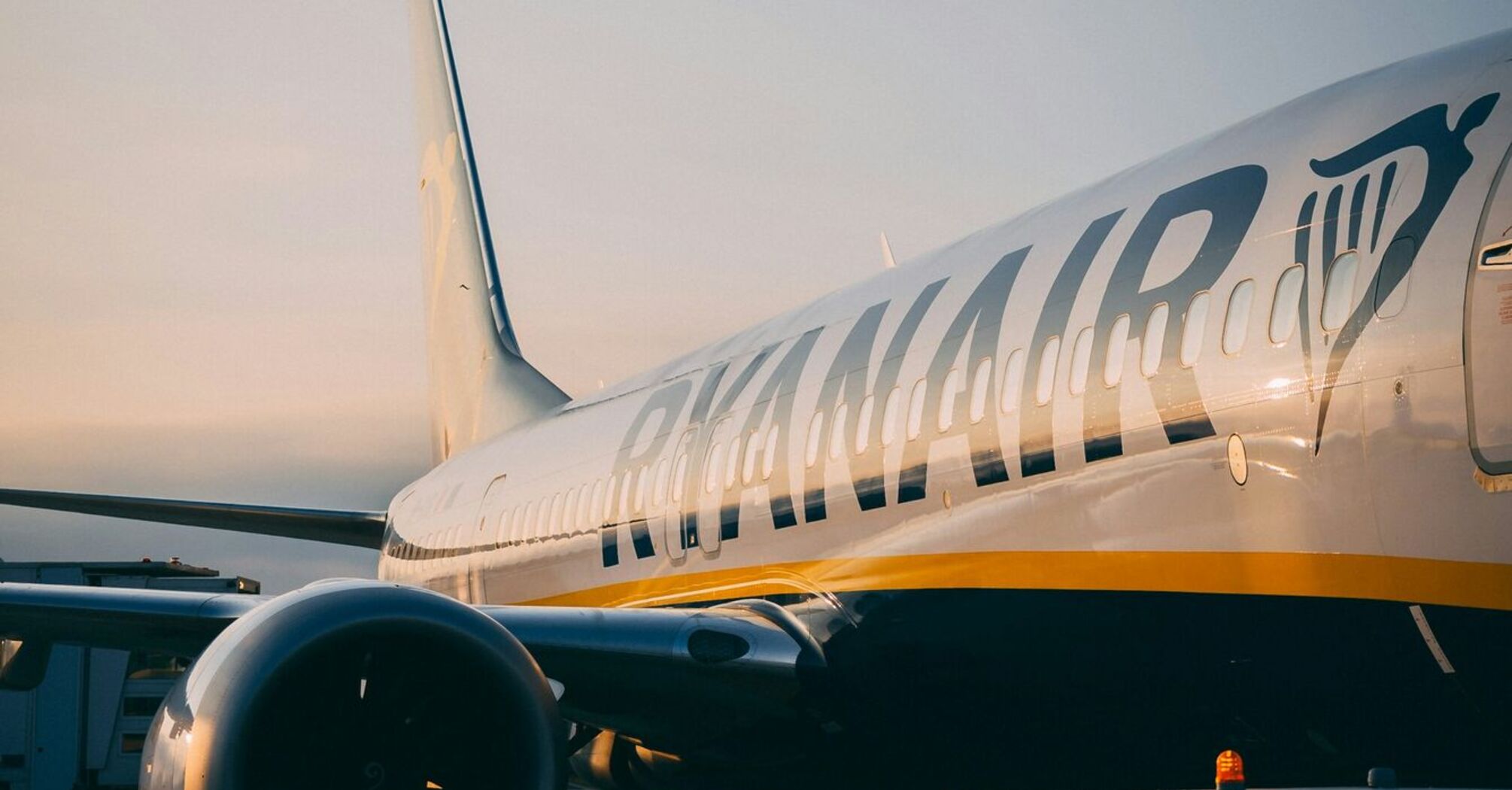 Ryanair aircraft parked on the apron at sunrise