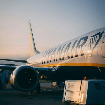 Ryanair aircraft parked on the apron at sunrise