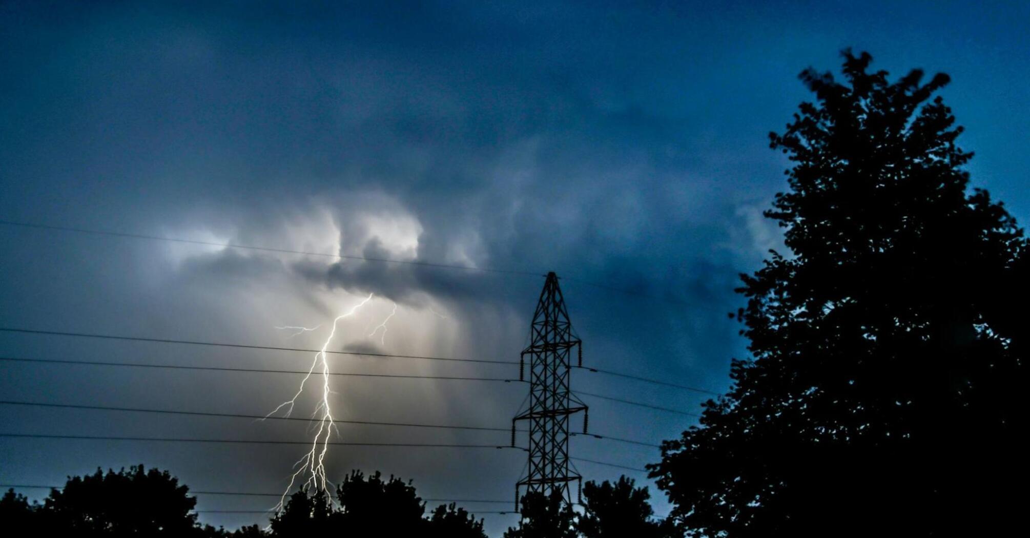 Lightning strike during a severe storm at dusk