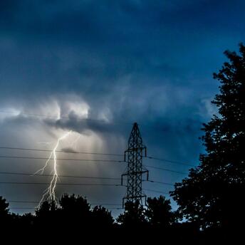Lightning strike during a severe storm at dusk