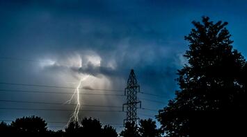 Lightning strike during a severe storm at dusk