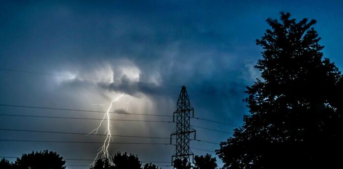 Lightning strike during a severe storm at dusk