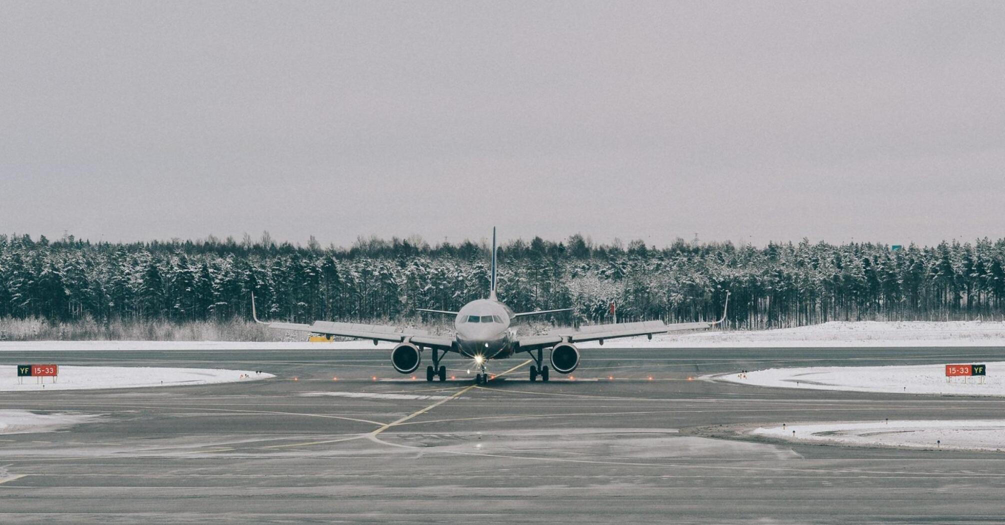 Passenger aircraft taxiing in cold weather at a regional airport