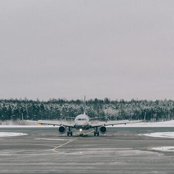 Passenger aircraft taxiing in cold weather at a regional airport