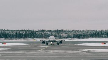Passenger aircraft taxiing in cold weather at a regional airport