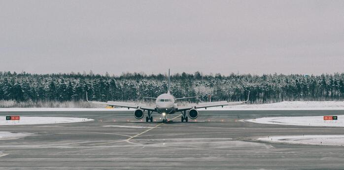 Passenger aircraft taxiing in cold weather at a regional airport