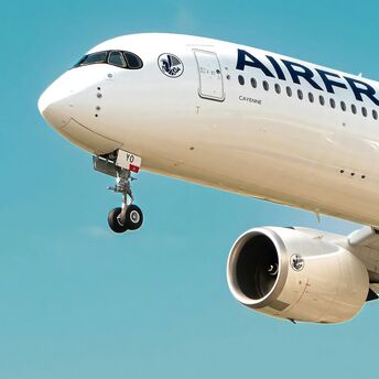 Air France Airbus aircraft climbing against a clear blue sky