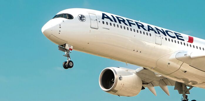 Air France Airbus aircraft climbing against a clear blue sky