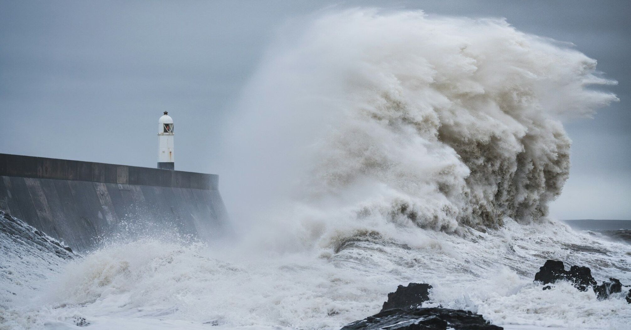 Rough sea wave under dark storm clouds