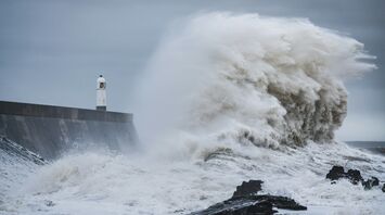 Rough sea wave under dark storm clouds