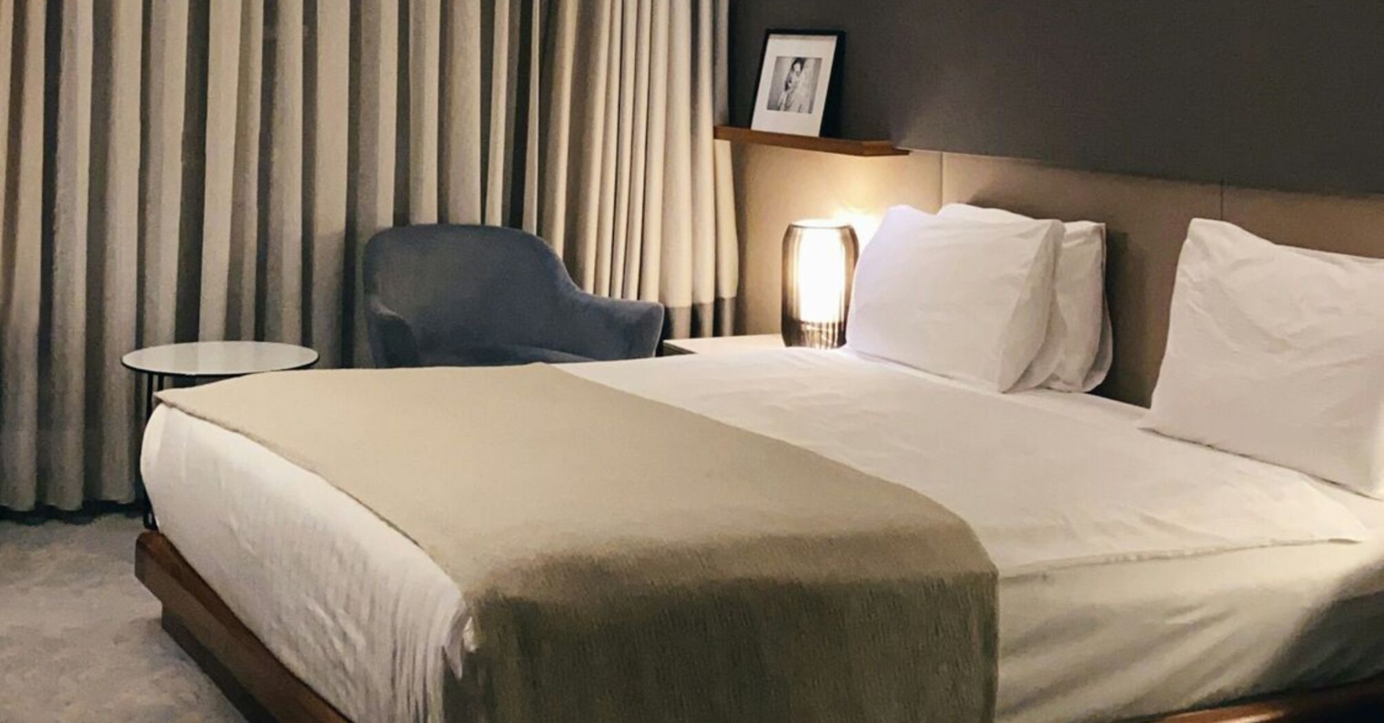 Modern hotel room with soft lighting and minimalist decor