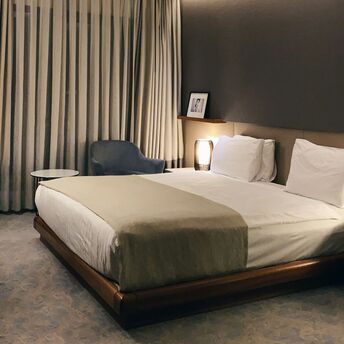 Modern hotel room with soft lighting and minimalist decor