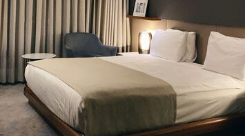 Modern hotel room with soft lighting and minimalist decor