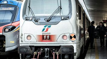 Italian regional trains at a busy station platform