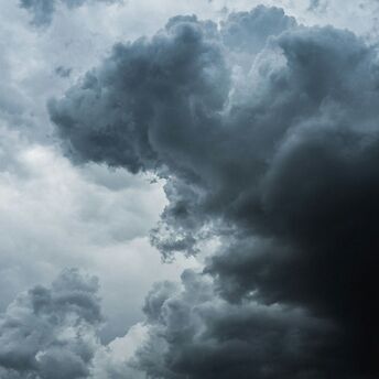 Dark storm clouds forming in the sky, signaling an approaching storm