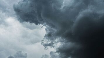 Dark storm clouds forming in the sky, signaling an approaching storm