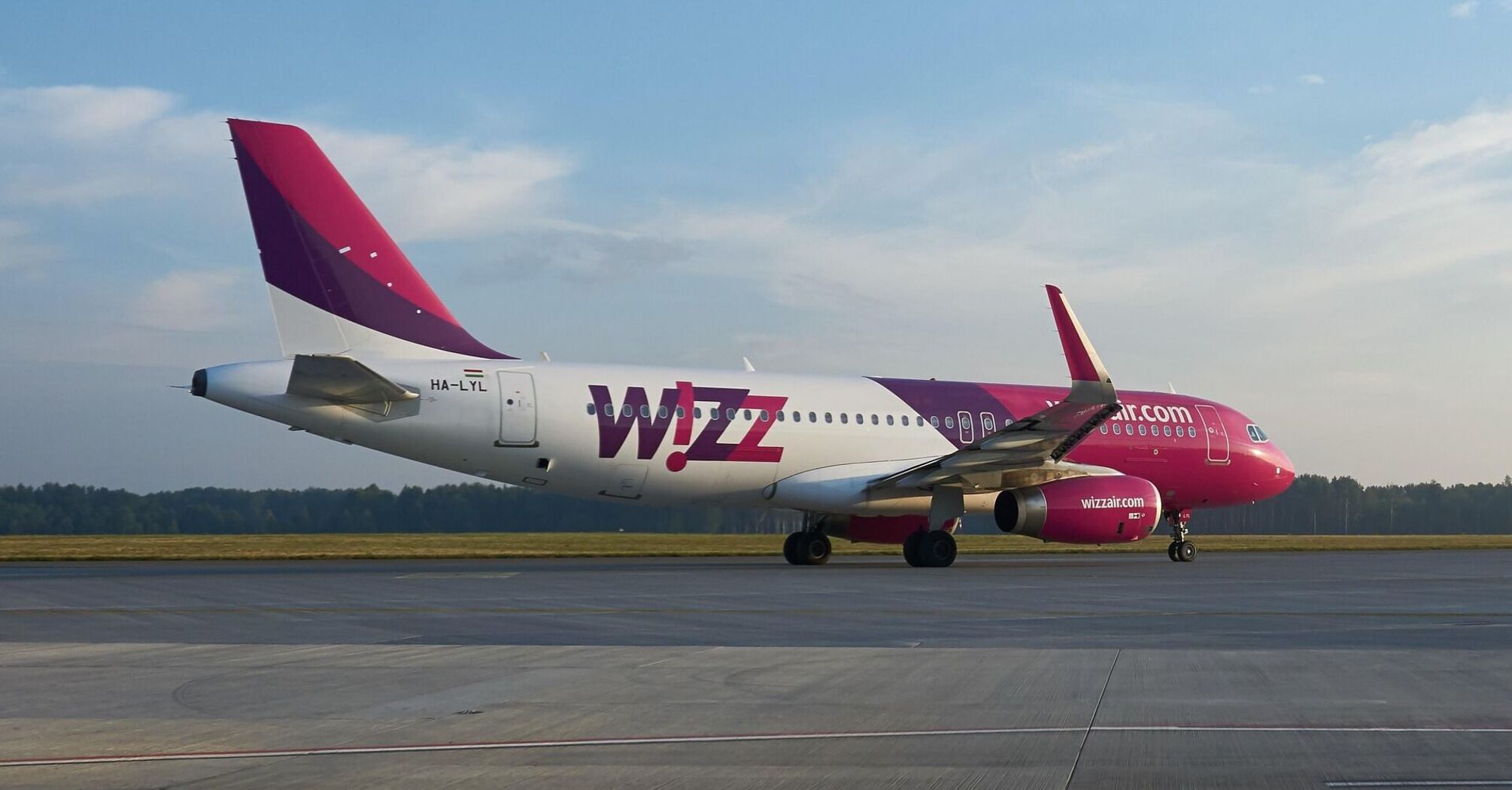 A Wizz Air aircraft on the runway, preparing for departure