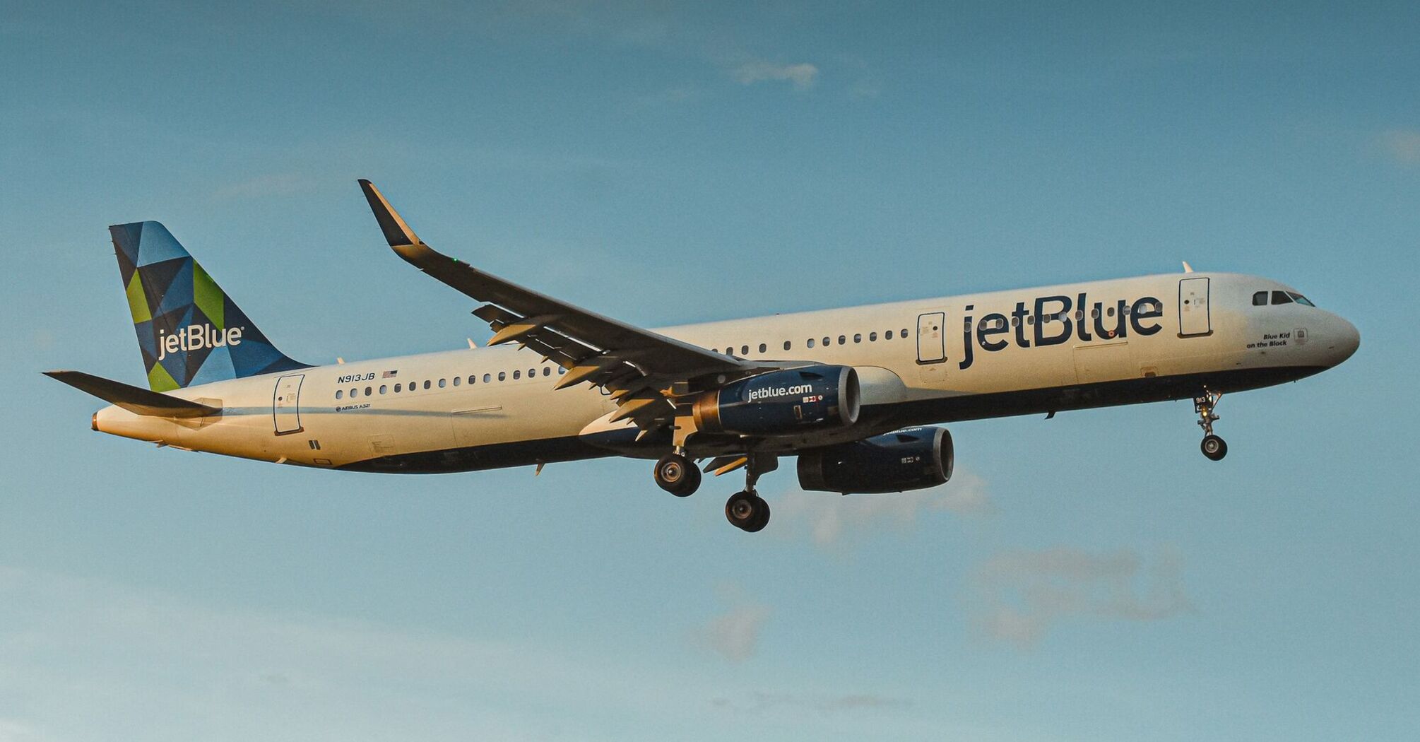 JetBlue airplane flying high in the sky