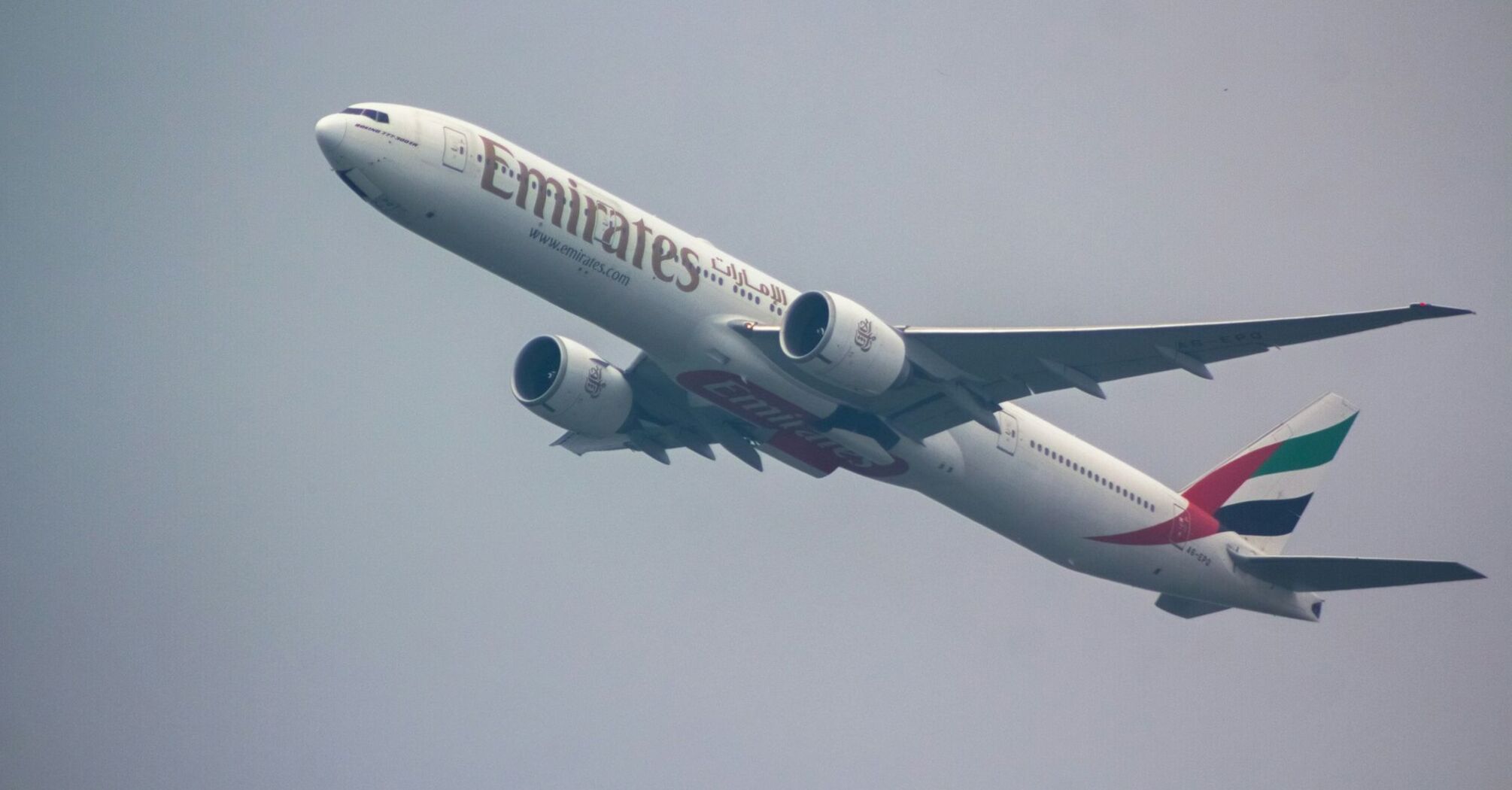 Emirates Boeing 777 aircraft flying in the sky