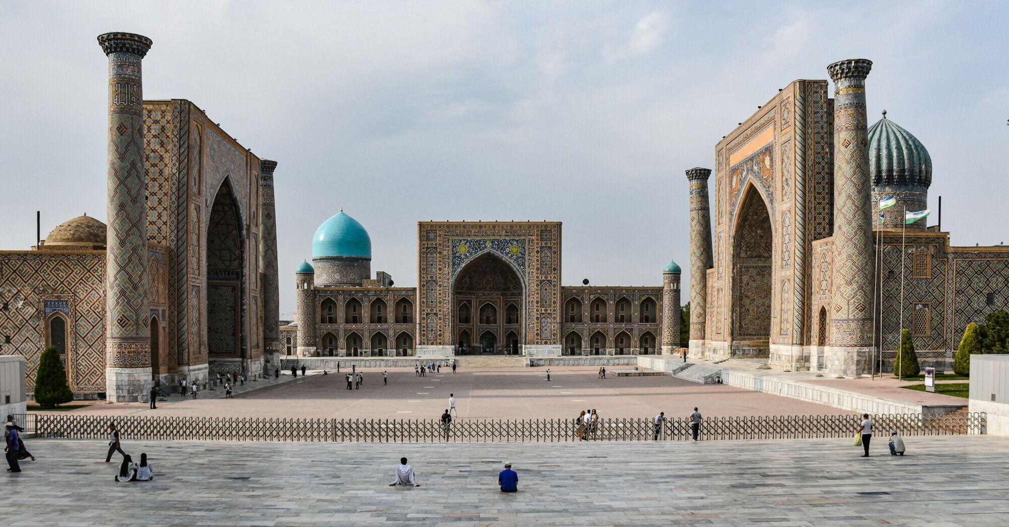 Registan Square in Samarkand, Uzbekistan, featuring historic madrassahs with intricate tilework and turquoise domes