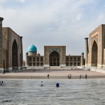 Registan Square in Samarkand, Uzbekistan, featuring historic madrassahs with intricate tilework and turquoise domes
