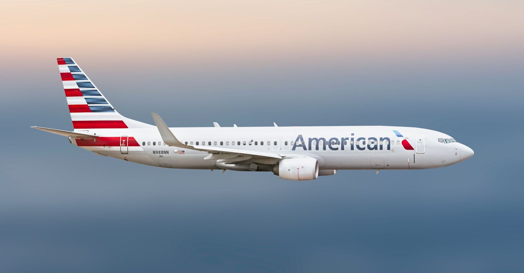 American Airlines Boeing 737 aircraft in flight against a gradient sky