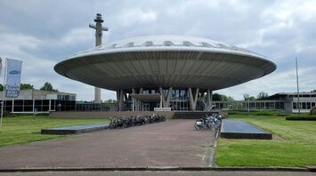 Traveler relaxing in an airport lounge while watching a plane take off