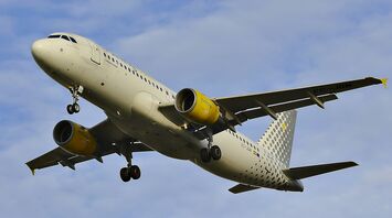 Vueling plane in flight with landing gear deployed