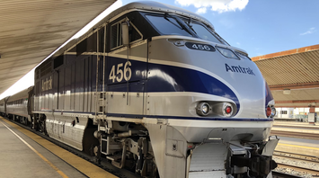 Amtrak locomotive at a station platform, ready for departure