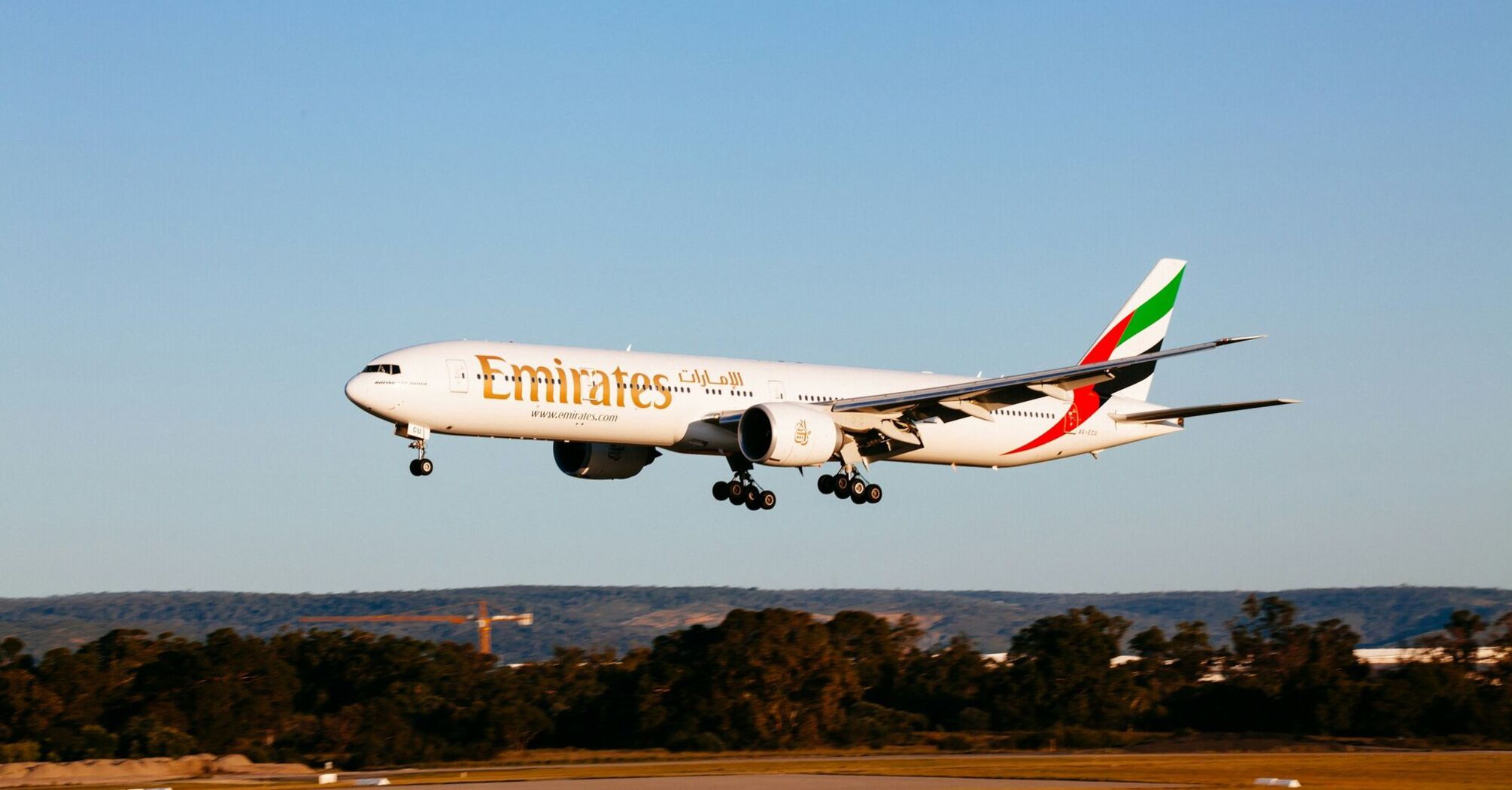 Emirates aircraft approaching runway during landing