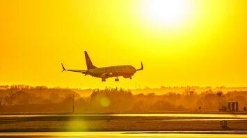 Ryanair plane landing at sunset at Manchester Airport