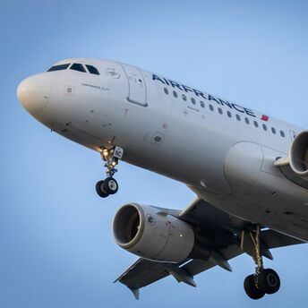Air France airplane approaching for landing with landing gear deployed