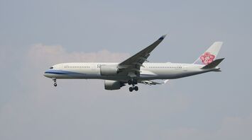 China Airlines aircraft preparing to land with landing gear deployed