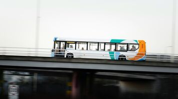 Stagecoach bus carrying passengers on elevated road in Scotland