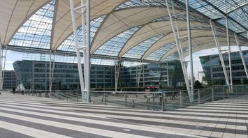 Munich Airport's central plaza with glass roof and modern architecture