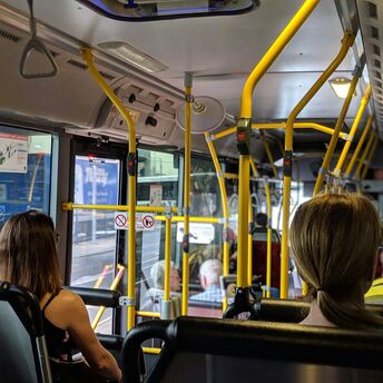 Passengers seated inside a city bus