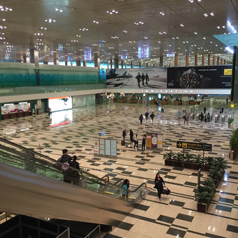 Interior view of Singapore Changi Airport Terminal 2 with immigration area and directional signs