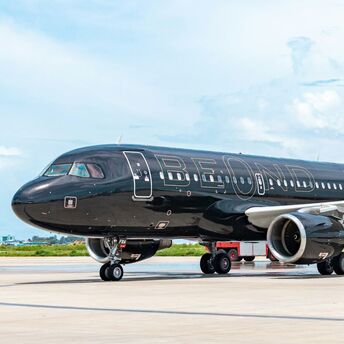 beOnd aircraft on runway with luxury black livery